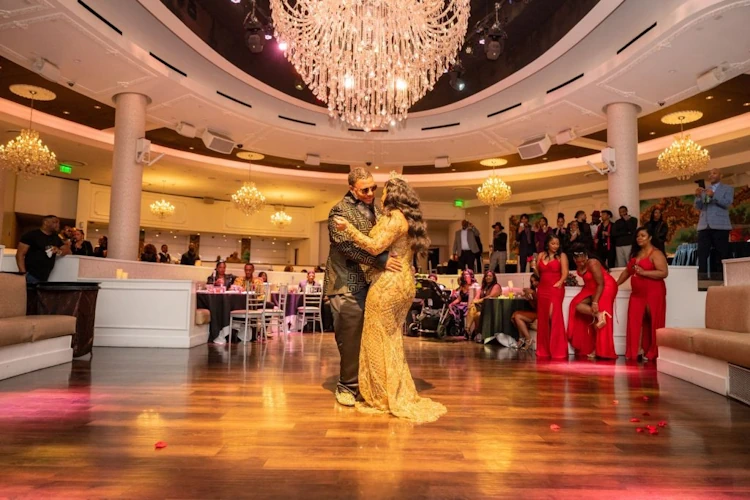 the bride and groom doing the first dance at the wedding-reception